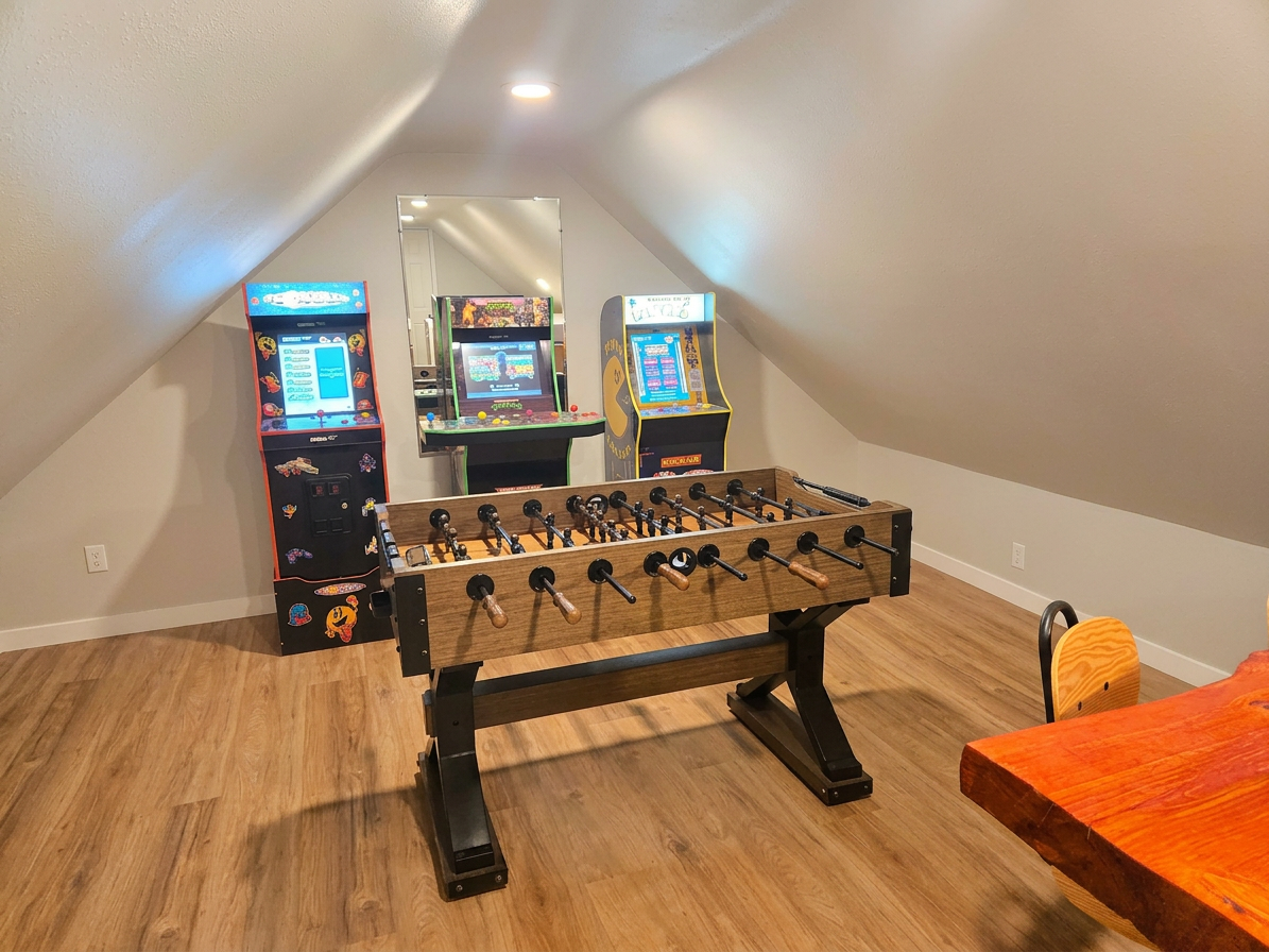 Arcade room with foosball and basketball