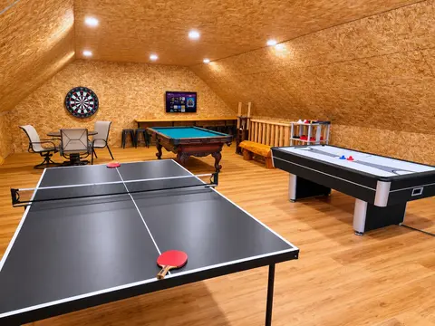 Turn up the fun in this spacious loft game room—perfect for groups and families. Enjoy a full lineup of entertainment including pool, ping pong, air hockey, and an arcade-style basketball game. Watch sports on the TV while you play!