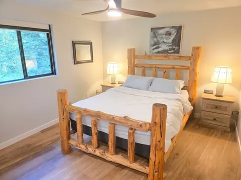 Private bedroom located at the far end of the house. Sleep late with the blackout curtains if you please! Charging stations at each nightstand make using your devices simple and easy.