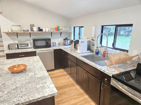 Kitchen is stocked with appliances for your cooking needs. Enjoy cooking while surrounded by luxury granite. Full oven, dishwasher, coffee maker, filtered water, electric kettle, instapot, crockpot, blender, toaster, microwave and toaster oven.